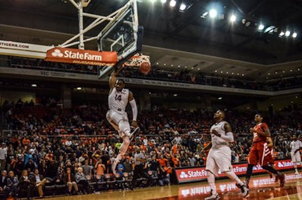 Antoine Mason throws down a dunk in the Tigers' exhibition victory over West Alabama.