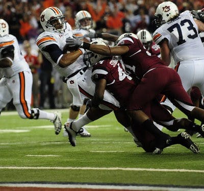 Auburn's Cam Newton scores in the first half of the SEC Championship Game. (Todd Van Emst / Auburn Media Relations)