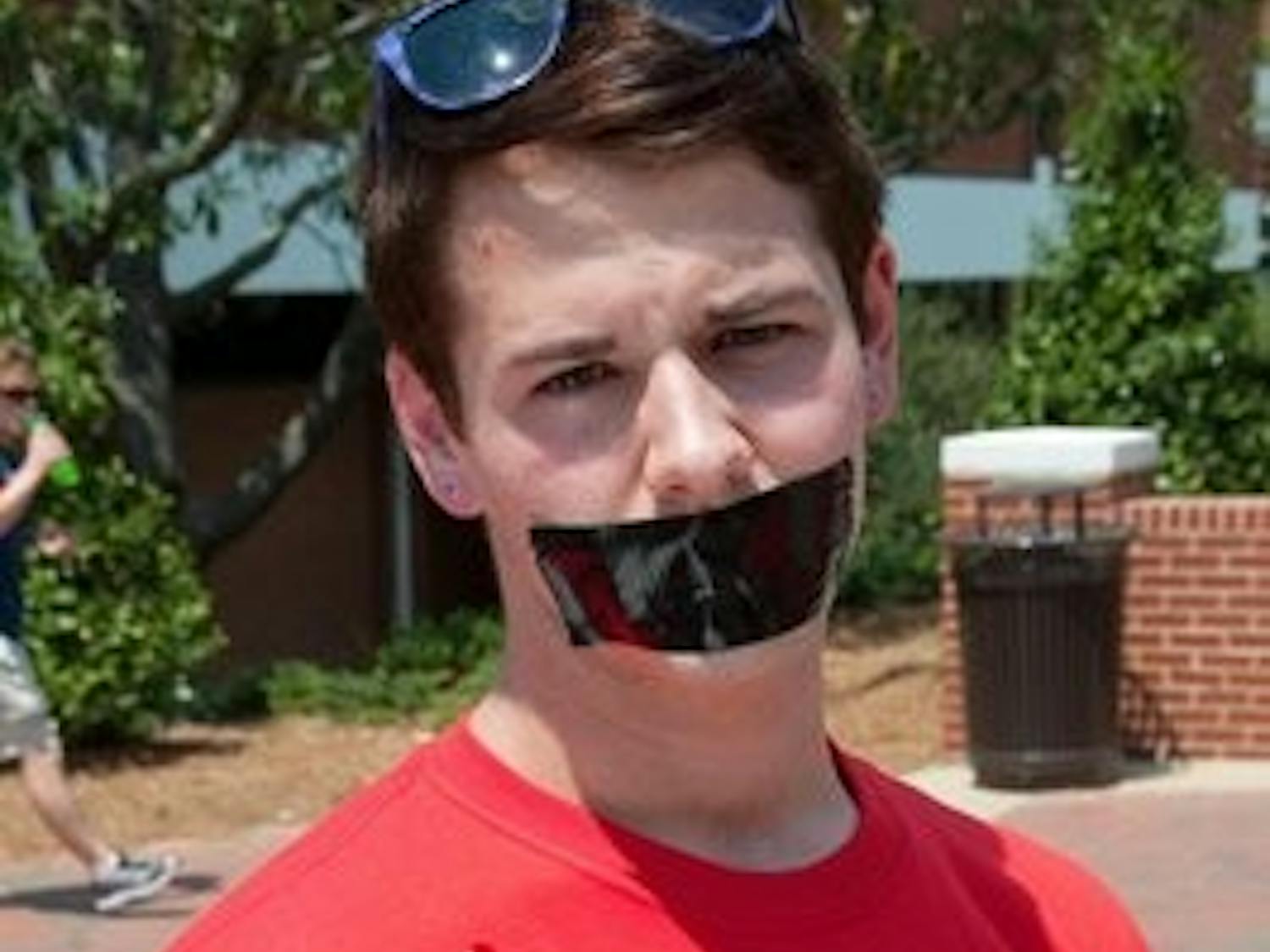 Adam Gatlin has taken a vow of silence to support the Gay Straight alliance's cause. His shirt reads, "Hear No, Speak No, See No Hate." Philip Smith / ASSISTANT PHOTO EDITOR