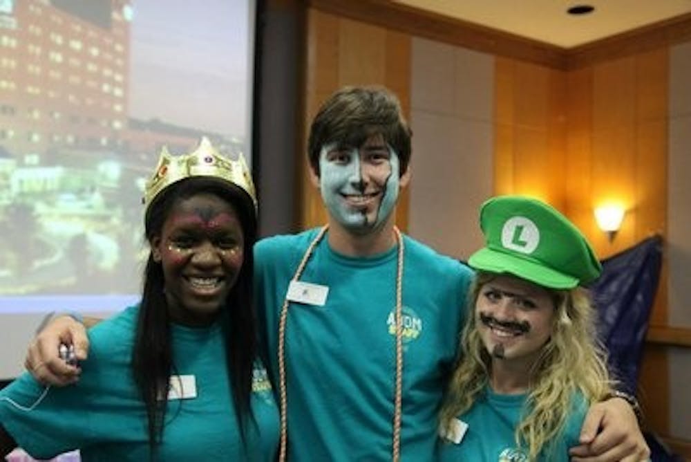 Jasmine Amoo, sophomore in undeclared science and math, Will McCann, sophomore in pre-business and Casey Stein, junior in human development and family studies, at the Fall Festival at the Children's Miracle Network Hospital in Columbus, Ga. (Contributed)