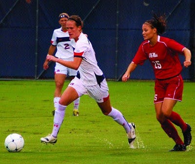 Auburn's Mary Coffed dribbles by an Ole Miss defender. (Katie Shelton/ Photo Staff)