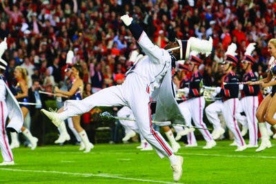 Head drum major Daniel Johnson and the marching band performing at the Ole miss game. (Rebecca Croomes / ASSISTANT PHOTO EDITOR)
