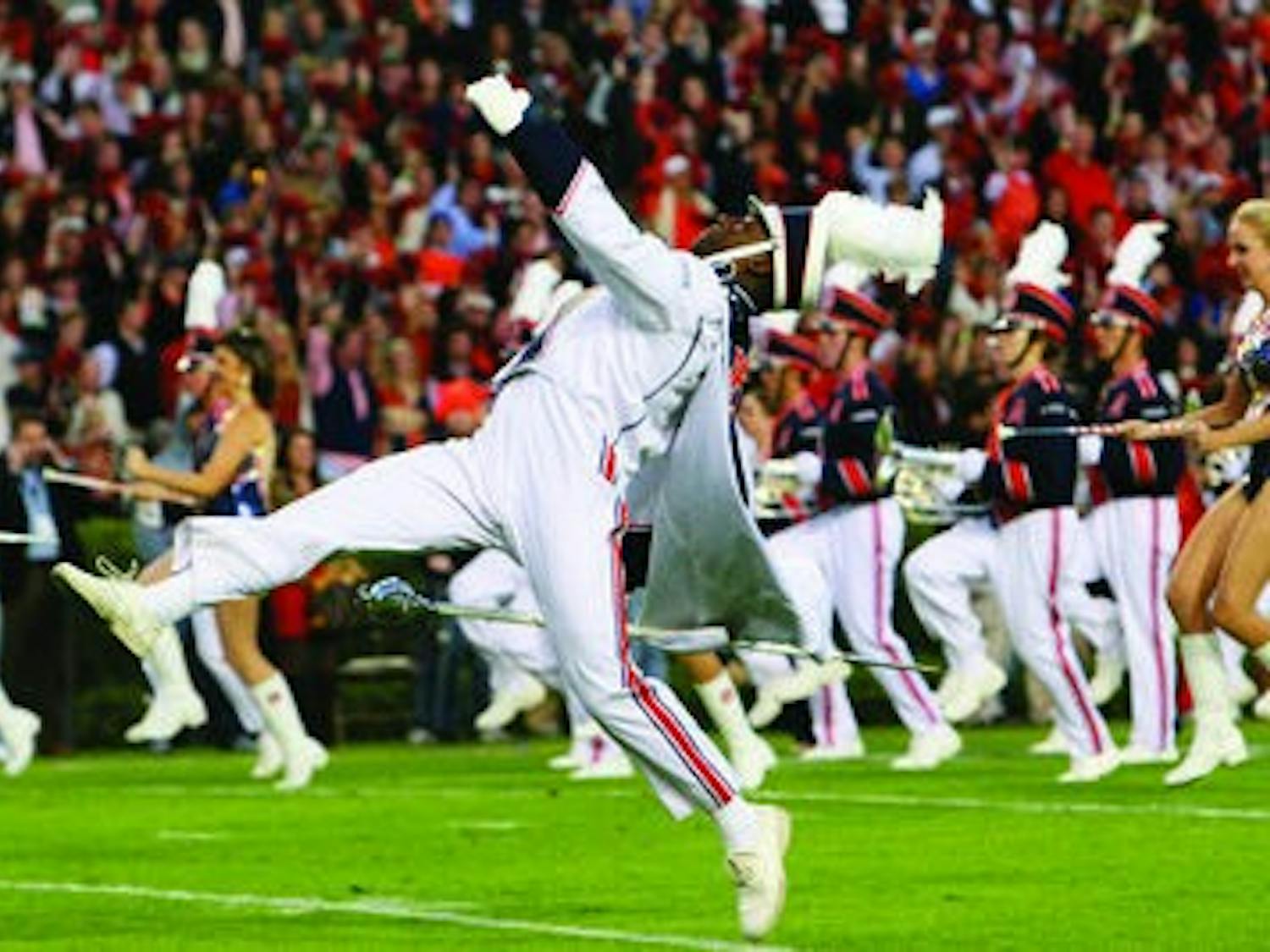 Head drum major Daniel Johnson and the marching band performing at the Ole miss game. (Rebecca Croomes / ASSISTANT PHOTO EDITOR)
