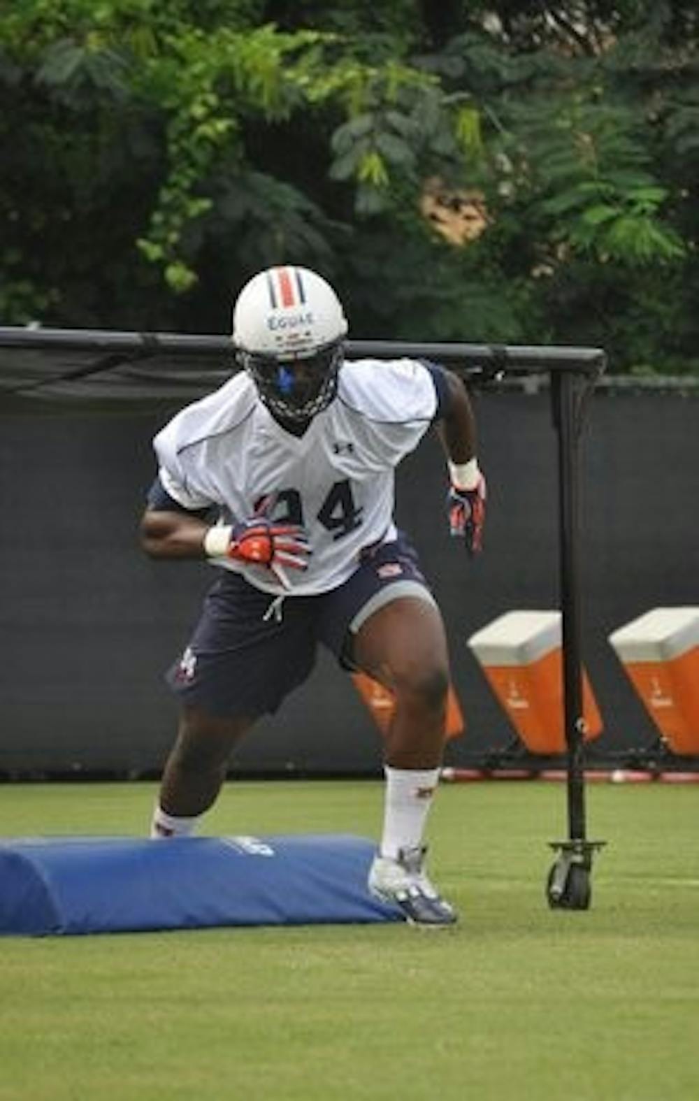 Defensive lineman Nosa Egua goes through drills. (Anna Grafton / ASSISTANT PHOTO EDITOR)