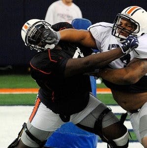 Sophomore Tunde Fariyike (left) practices against Jamar Travis on Friday, August 3. Fariyike will take over the starting job at center while 2011 freshman All-American Reese Dismukes serves his indefinite suspension for public intoxication. (Courtesy of Todd Van Emst)