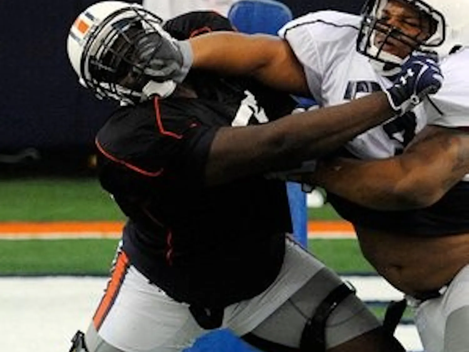 Sophomore Tunde Fariyike (left) practices against Jamar Travis on Friday, August 3. Fariyike will take over the starting job at center while 2011 freshman All-American Reese Dismukes serves his indefinite suspension for public intoxication. (Courtesy of Todd Van Emst)