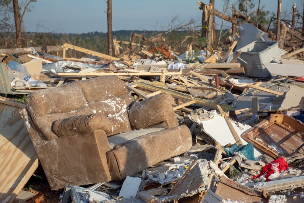 A couch sits on a pile of wreckage on March 4, 2019, in Beauregard, Alabama, after a tornado killed 23 people and left dozens of other injured and without homes. 