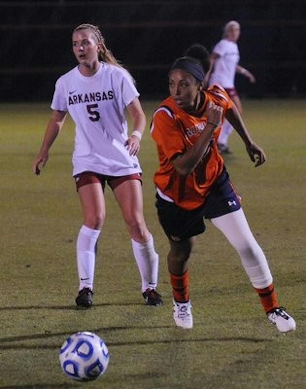 Chelsea Gandy-Cromer fighting for the ball against Arkansas. (Contributed by Kyle Taylor and Auburn Athletics)