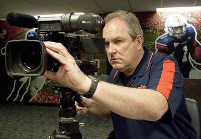 Every Tuesday in the fall, like clockwork, Sain can be found in the athletic complex filming press conferences. (Emily Adams / photo Editor)