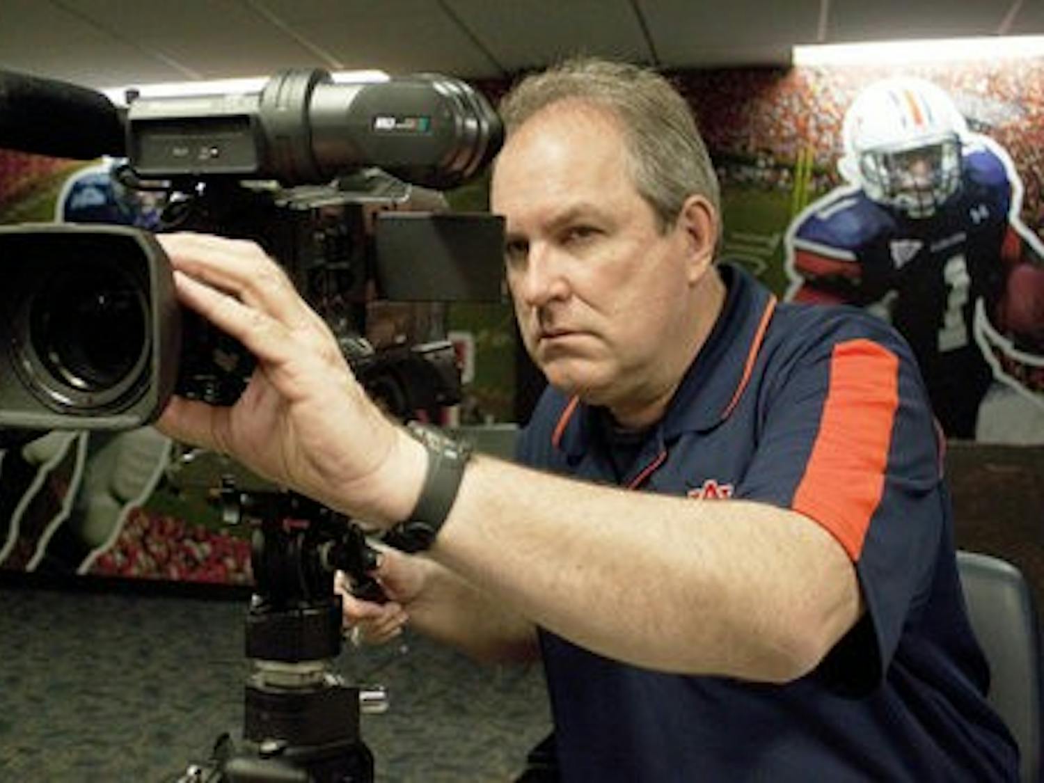 Every Tuesday in the fall, like clockwork, Sain can be found in the athletic complex filming press conferences. (Emily Adams / photo Editor)