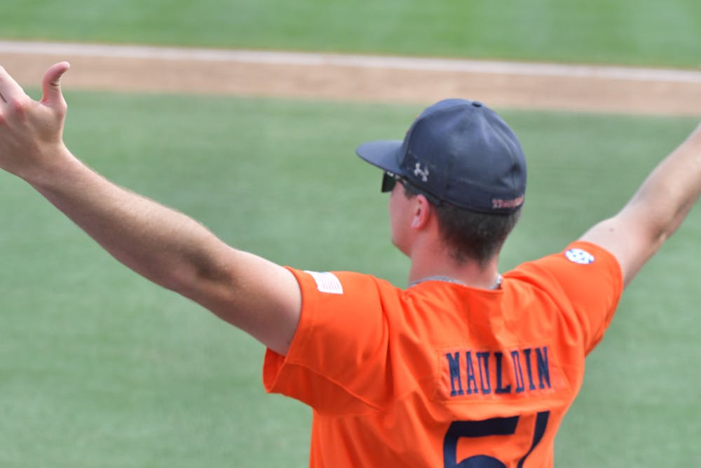 <p>Junior Ty Mauldin celebrates outside the Auburn dugout after a two-RBI single from Kason Howell gave the Tigers an 11-2 lead over LSU. Auburn went on to win 12-2 in seven innings over the No. 1 Bayou Bengals.</p>