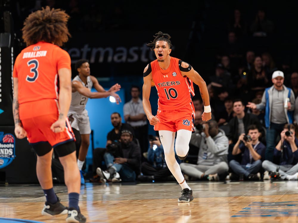 Chad Baker-Mazara celebrates a three pointer as he runs down court during the first half of the 2023 Legends Classic Championship