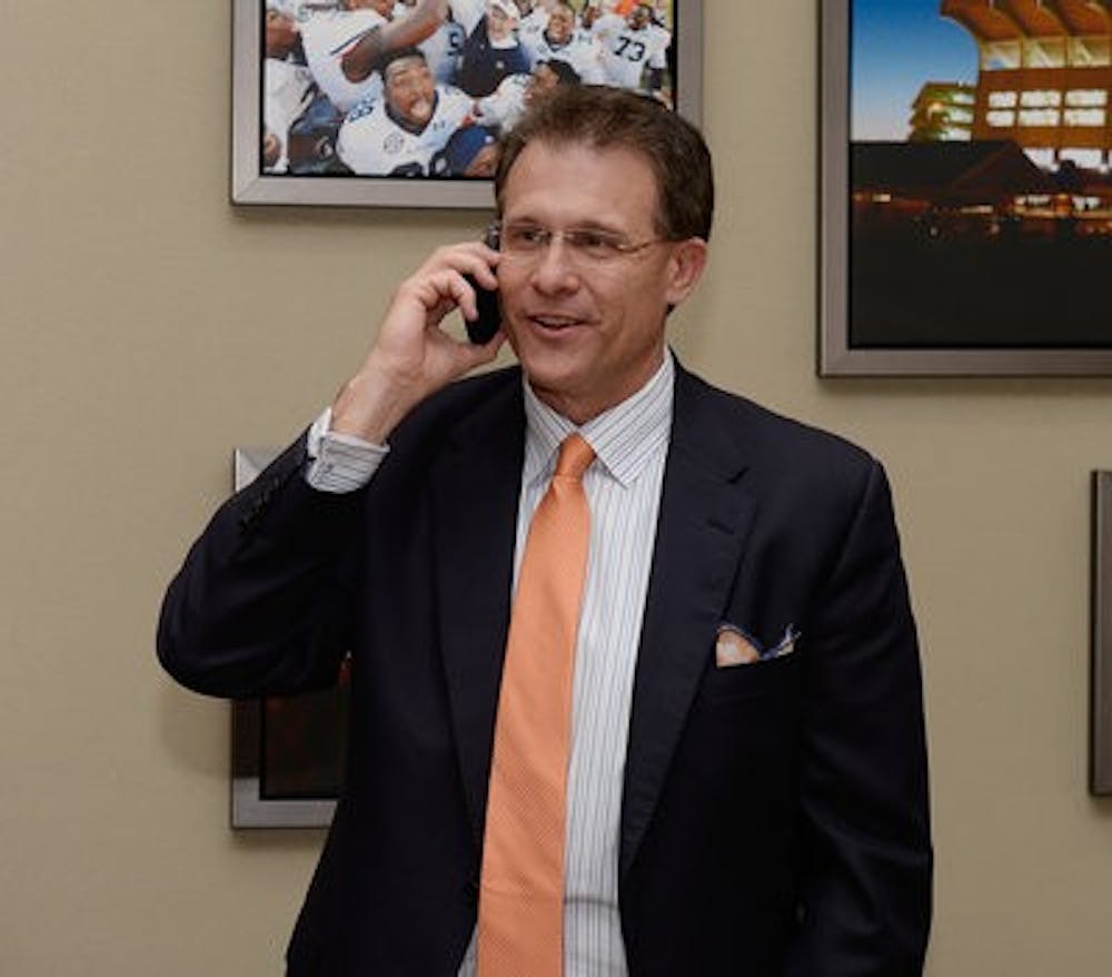 Gus Malzahn calls Andrew Williams upon seeing his commitment to Auburn on Signing Day, Wednesday, Feb. 5, 2014. (Contributed by Lauren Barnard)