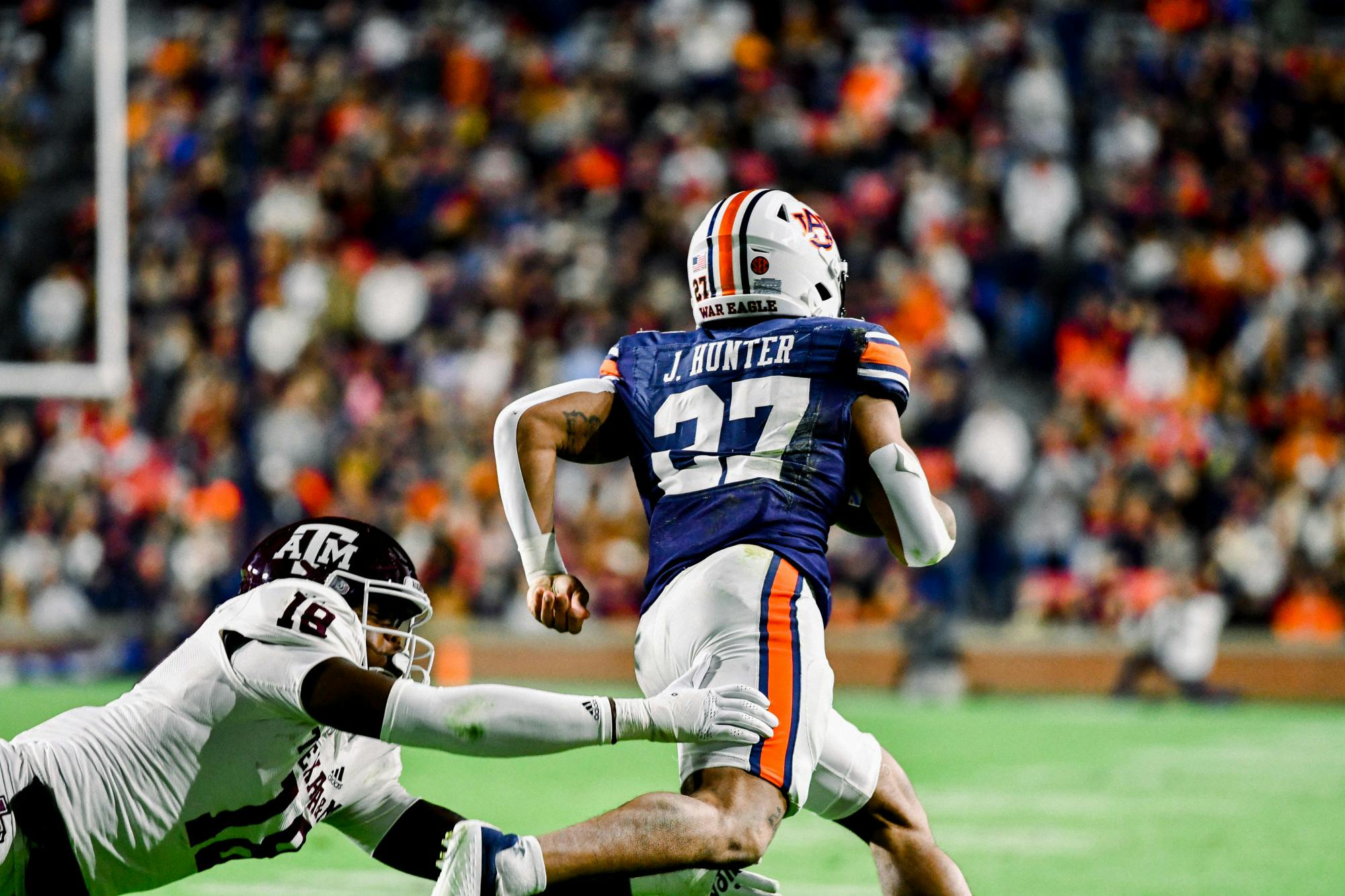 Running Back Jarquez Hunter (#27) outruns a defender in Jordan-Hare Stadium against Texas A&amp;M on November 12, 2022.&nbsp;