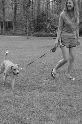 Rachael Colley, pharmacy student, takes her dog Luke for a walk in Kiesel Park. (Christen Harned / ASSISTANT PHOTO EDITOR)