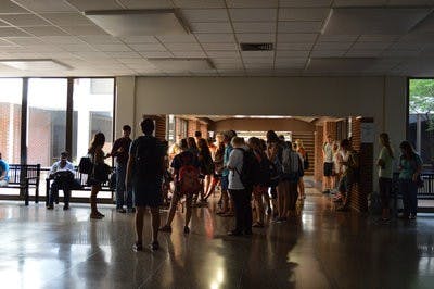 Students stand in the dark in Haley Center during the second power outage.