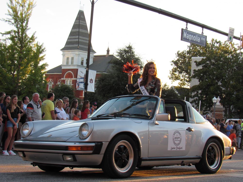 <p>Miss Alabama Lauren Bradford rides through the Homecoming Parade on Sept. 24, 2021, in Auburn, Ala.</p>