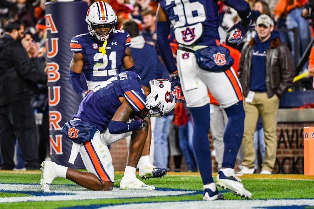 Auburn cornerback D.J. James (4) kneels in the end zone after a pick-six in the second half against Western Kentucky in Jordan-Hare Stadium on Nov. 19, 2022.