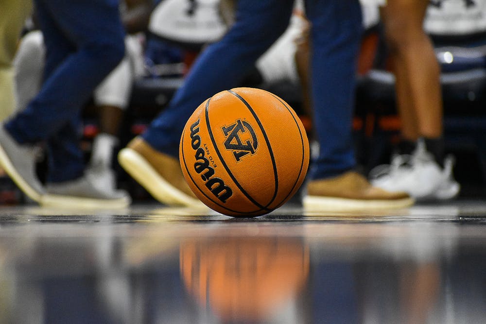 <p>A basketball with an Auburn logo sits on the court during a timeout in a match between Auburn and Yale in Auburn Arena on Dec. 4, 2021, in Auburn, Ala.</p>