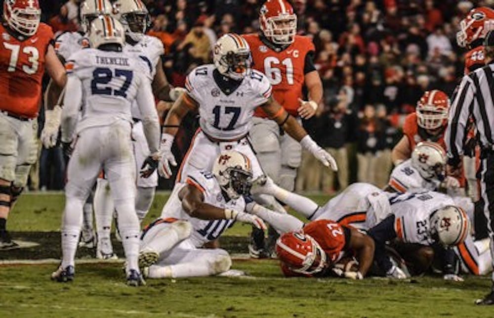 Nick Chubb breaks through Auburn's defense, where he rushed for 144 yards. (Raye May | Photo Editor)