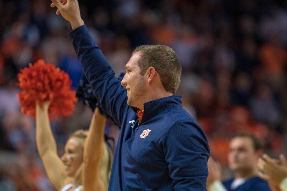 Kenny Dillingham Auburn Footballs's new Offensive Coordinator, waves to the crowd during Auburn Basketball vs. Kentucky, on Saturday, Jan. 19, 2019 in Auburn, Ala.