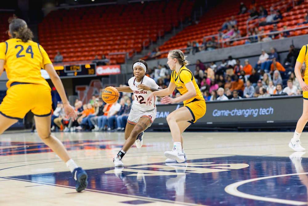 Auburn guard Mar'shaun Bostic (12) drives to the basket against California on November 17, 2023 in Neville Arena. 