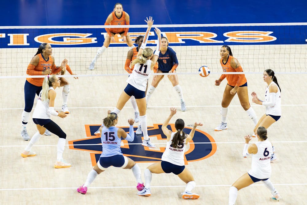 The Auburn volleyball team executes a play during the game in Neville Arena versus the University of Virginia on Sept. 9, 2025.