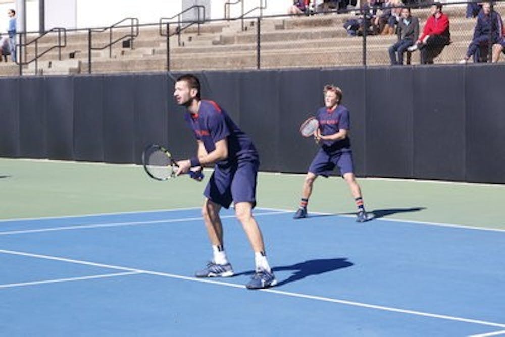 <p>The doubles pair of Lukas Ollert (receiving) and Petar Tomic (at net). (ELLEN JACKSON / PHOTOGRAPHER)</p>