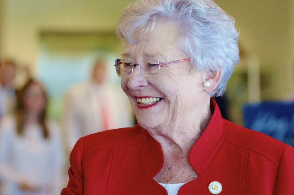 <p>Alabama Governor Kay Ivey greets supporters during a rally on Monday, June 4, 2018 in Auburn, Ala.</p>