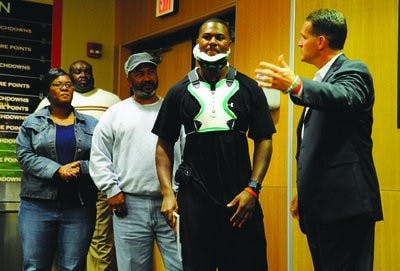 Zac Etheridge talks to Auburn's football team during a meeting Nov. 3, 2009 about his injury. (Todd Van Emst / Auburn Media Relations)