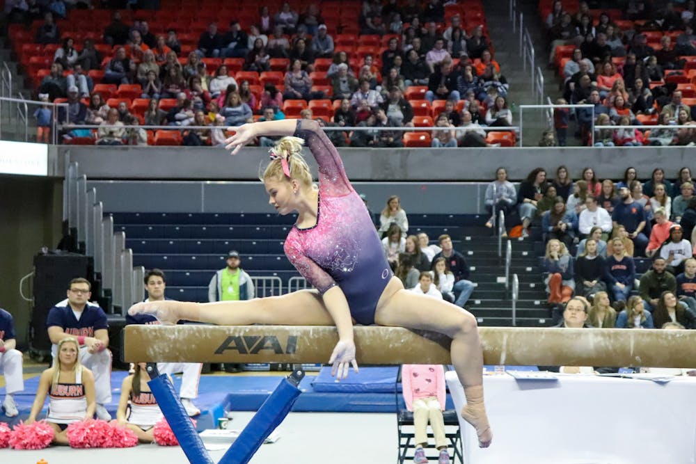 <p>Adeline Sabados on beam during Auburn University Gymnastics vs. Texas Women's University on Feb. 28, 2020, in Auburn, Ala.</p>