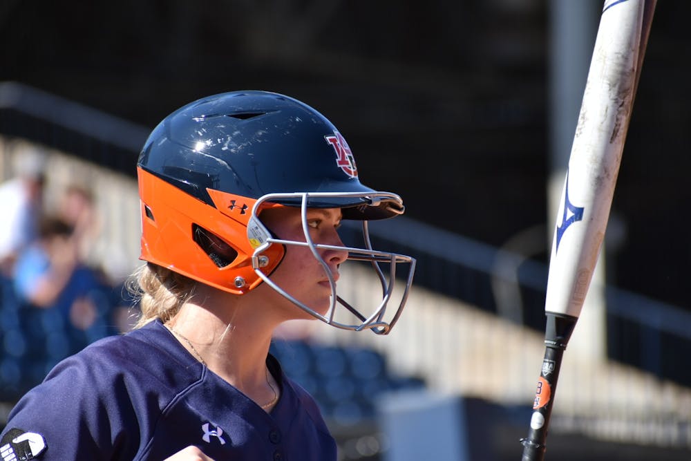 Freshman Riley McNemar looks on she prepares to take her place at bat for the Tigers. 