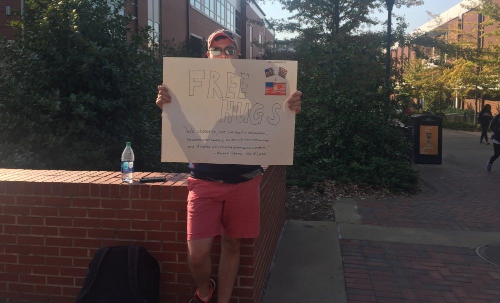 Calvin Duessel, junior in business, took to the concourse with a "free hugs" sign Thursday, Nov. 10.&nbsp;