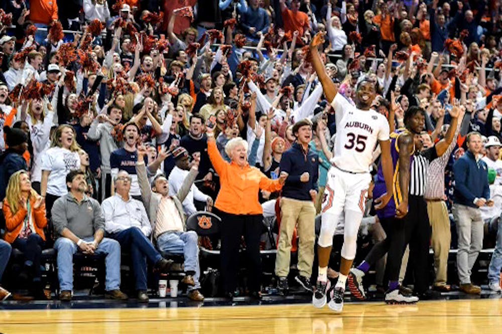 <p>Devan Cambrige shoots a three against LSU in an overtime victory in Auburn Arena.&nbsp;</p>