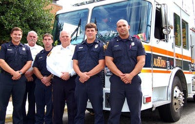 Auburn Fire Chief Lee Lamar gathers with Lt. Robert Hodge and firefighters Brandon Kohn, Logan Lambert, Jay Gibbs and Brandon Magill. Lamar said members of the fire department are like family. (Alison McFerrin / NEWS EDITOR)
