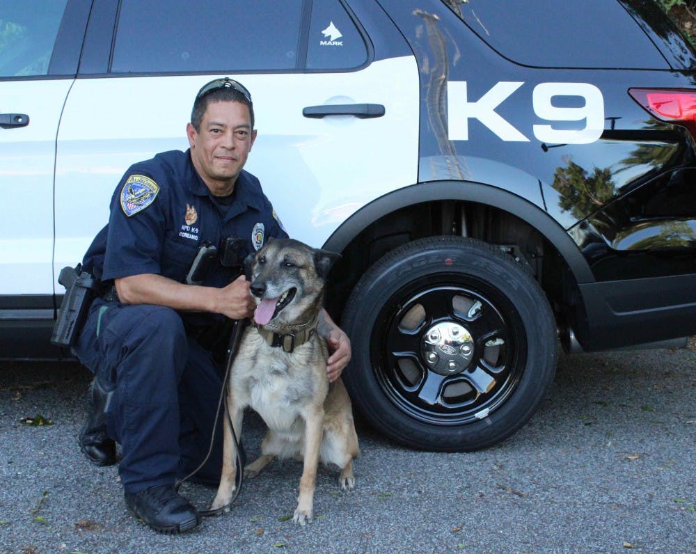 Auburn Police Officer Luis Coreano and K-9 Mark in front of their new police vehicle on April 16, 2018.