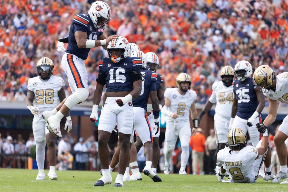 Auburn players celebrate a play against Vanderbilt on Nov. 2, 2024.