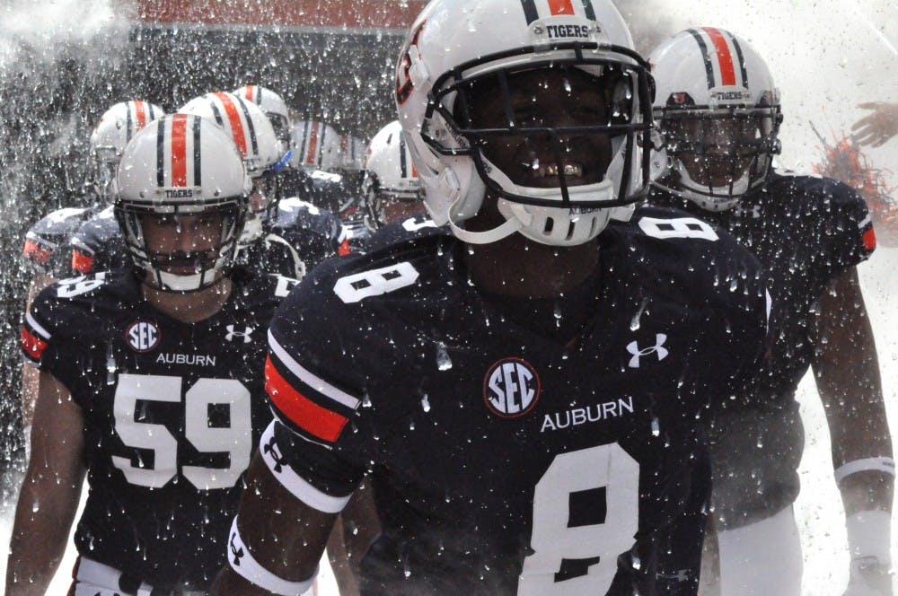 <p>Tony Stevens exits the tunnel on Saturday before the homecoming game against WCU. (FILE PHOTO)</p>