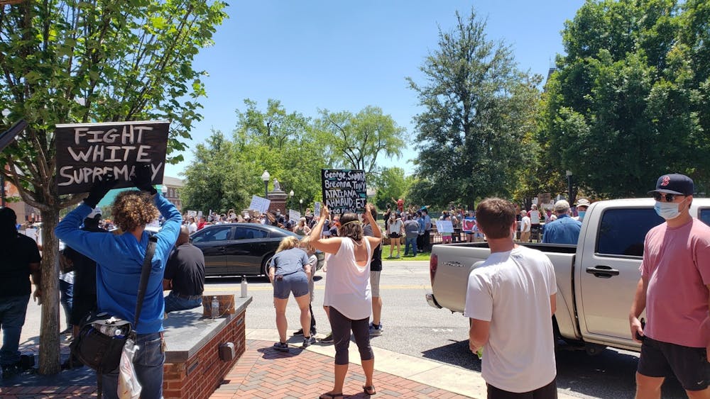 Hundreds of protestors held signs and chanted in downtown Auburn following the death of George Floyd