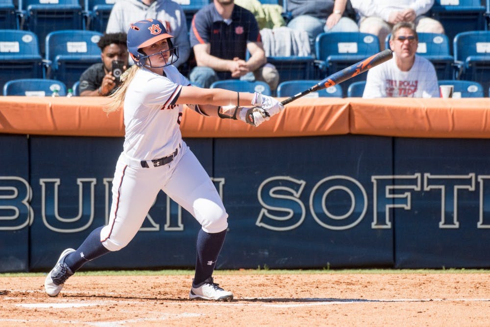 Tannon Snow watches the ball she hit&nbsp;during Auburn softball vs. Western Illinois on Sunday, Mar. 4, 2018, in Auburn, Ala.