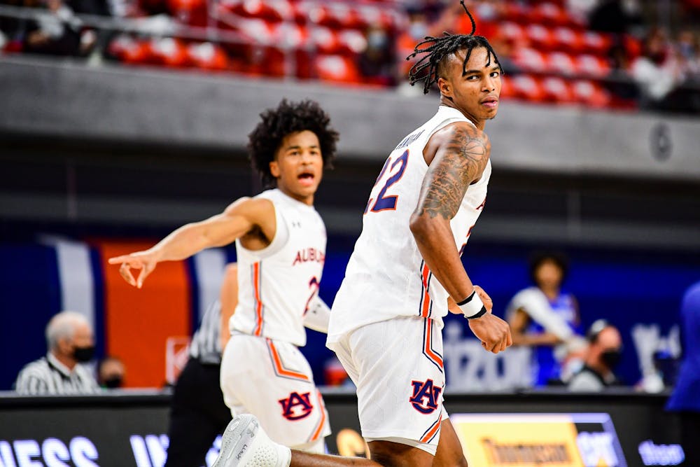 Jan 9, 2021; Auburn, AL, USA; Auburn Tigers guard Sharife Cooper (2) and guard Allen Flanigan (22) react after a play during during the game between Auburn and Kentucky at Auburn Arena. Mandatory Credit: Shanna Lockwood/AU Athletics
