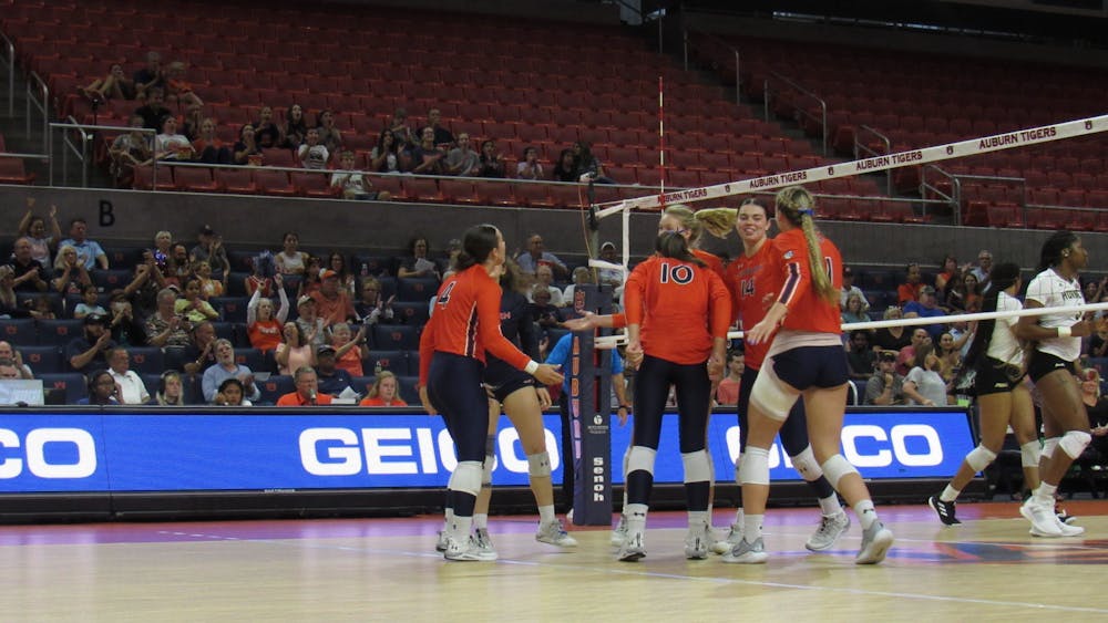 <p>The Auburn Volleyball Team celebrates after scoring against Alabama State inside Neville Arena in Auburn, Ala. on August 31, 2022.</p>