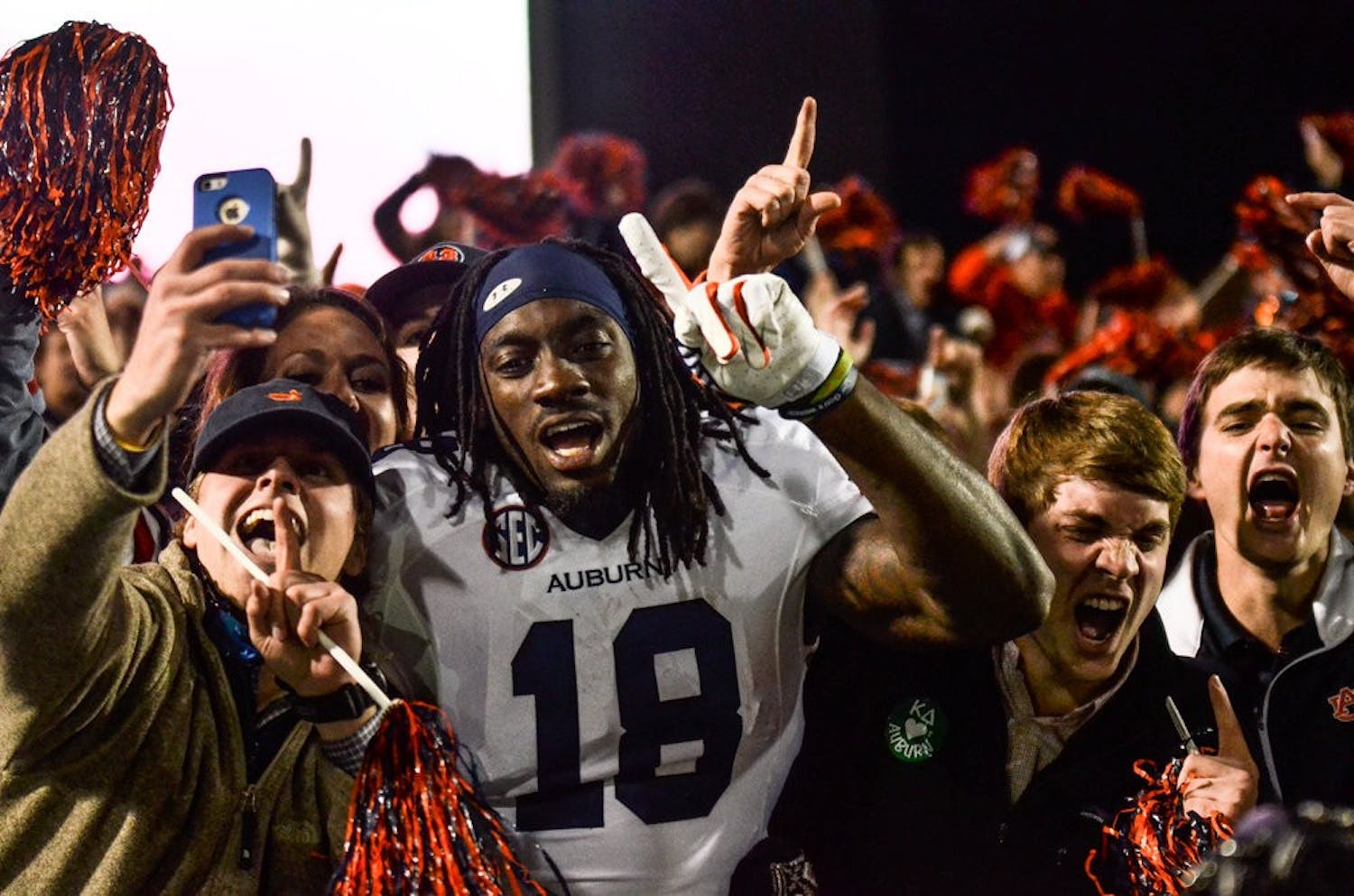 Sammie Coates celebrates with the Auburn section after the road win over Ole Miss.

Raye May / PHOTO EDITOR