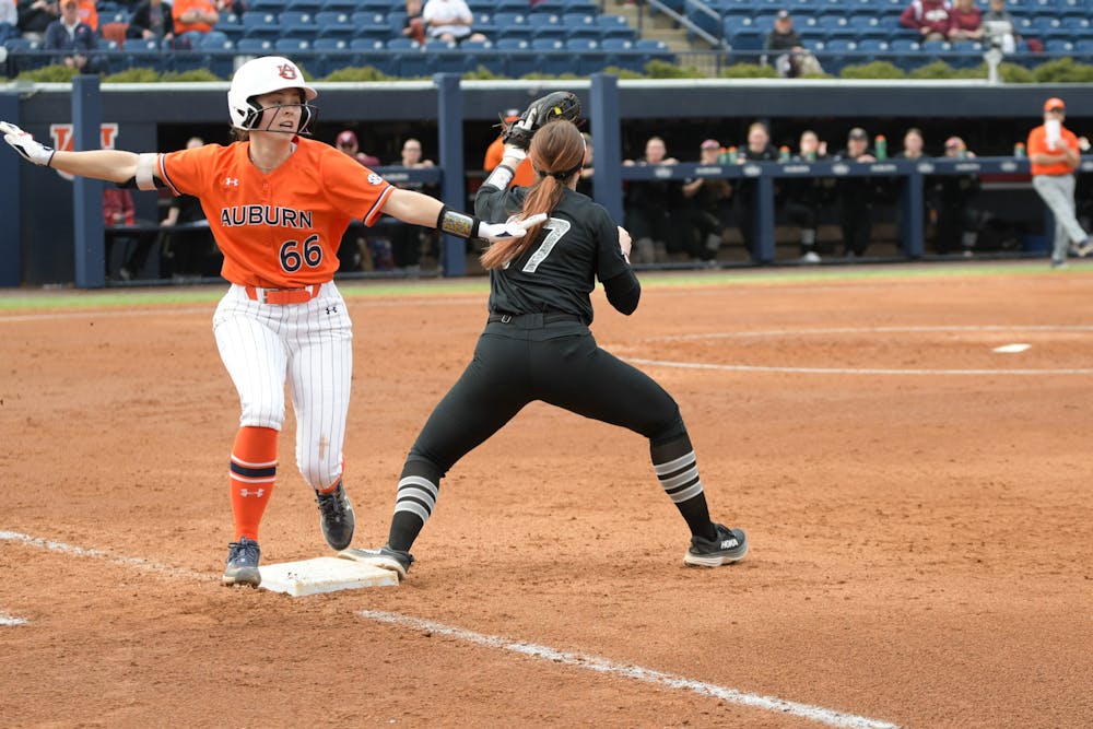 <p>Annabelle Widra (#66) is safe at first base against Virginia Tech at Jane B. Moore field on February 9th 2024</p>
