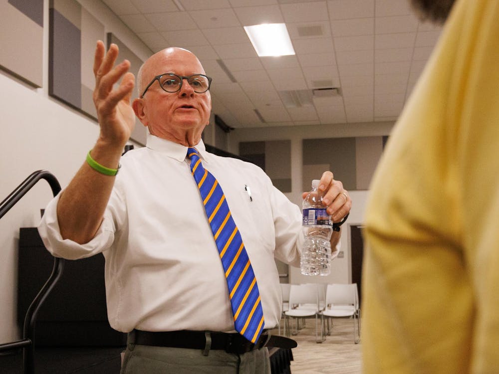 Congressional candidate Lee McInnis talks with potential voters during an open meeting in Opelika, Alabama in Nov. 19, 2025.