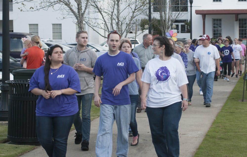 Supporters walk&nbsp;at the Opelika Ala. Relay for Life 2016 in downtown Opelika's Courthouse Square on Friday, Apr., 22.
