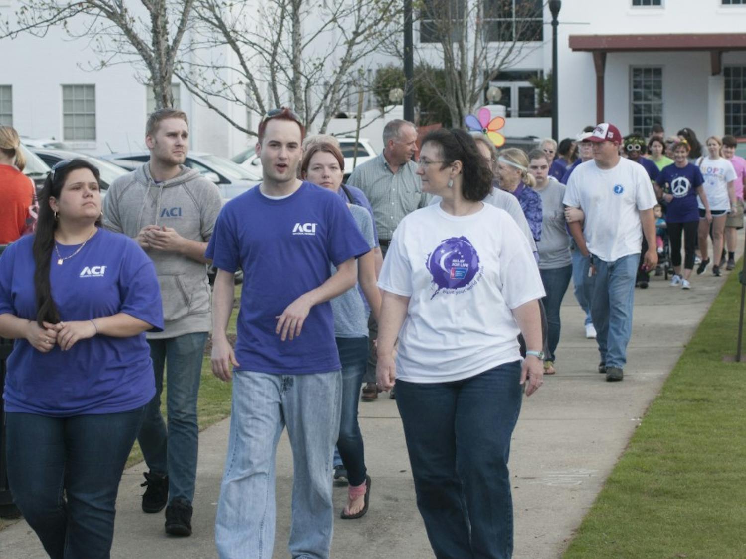 Supporters walk&nbsp;at the Opelika Ala. Relay for Life 2016 in downtown Opelika's Courthouse Square on Friday, Apr., 22.
