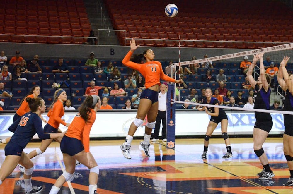 Breanna Barksdale (#11) jumping to hit the ball. (Michael Ontiveros | Photographer)
