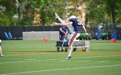 Junior kicker Steven Clark, 30, practices on Wednesday, April 17. (Raye May / PHOTO EDITOR)