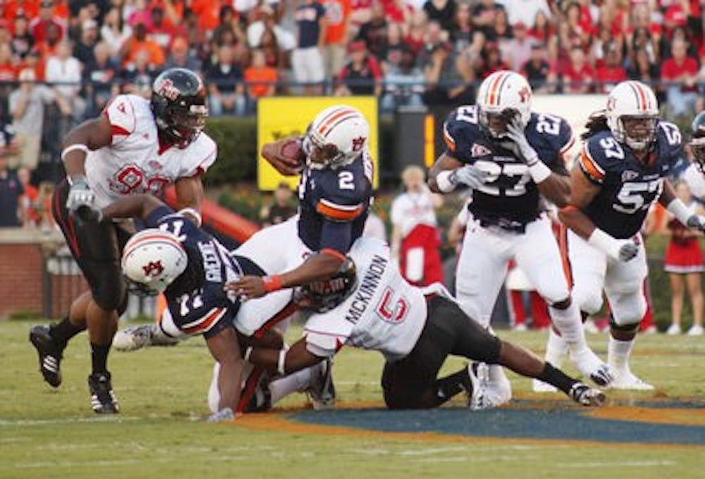 Junior quarterback Cam Newton makes a run against Arkansas State. (Emily Adams/PHOTO EDITOR)